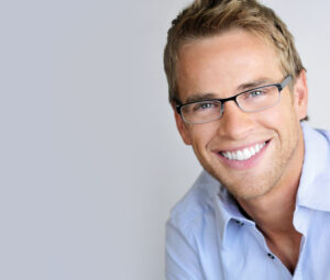 Handsome man with white smile and fashion eyeglasses